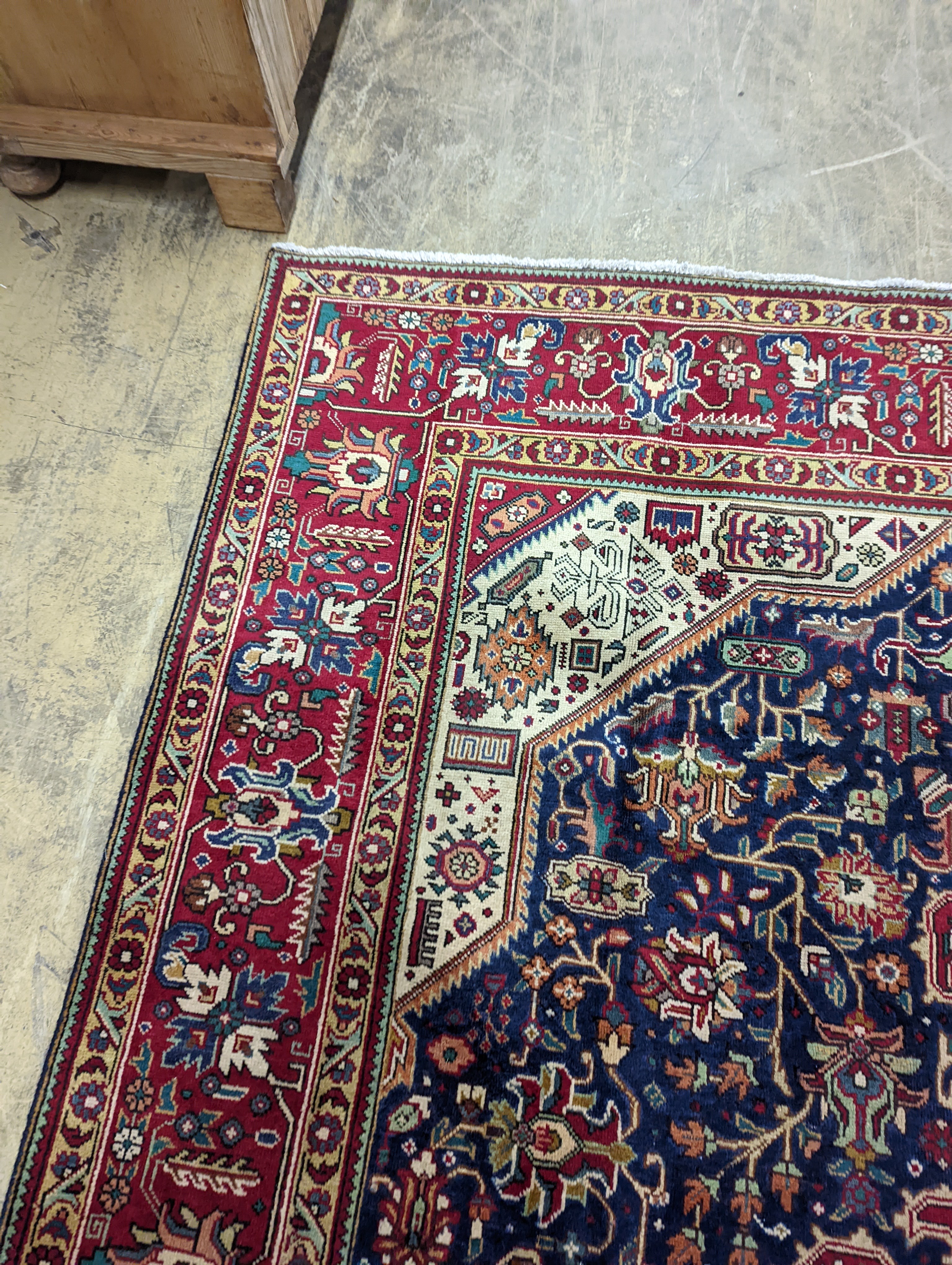 A Tabriz blue ground carpet, 290 x 200cm